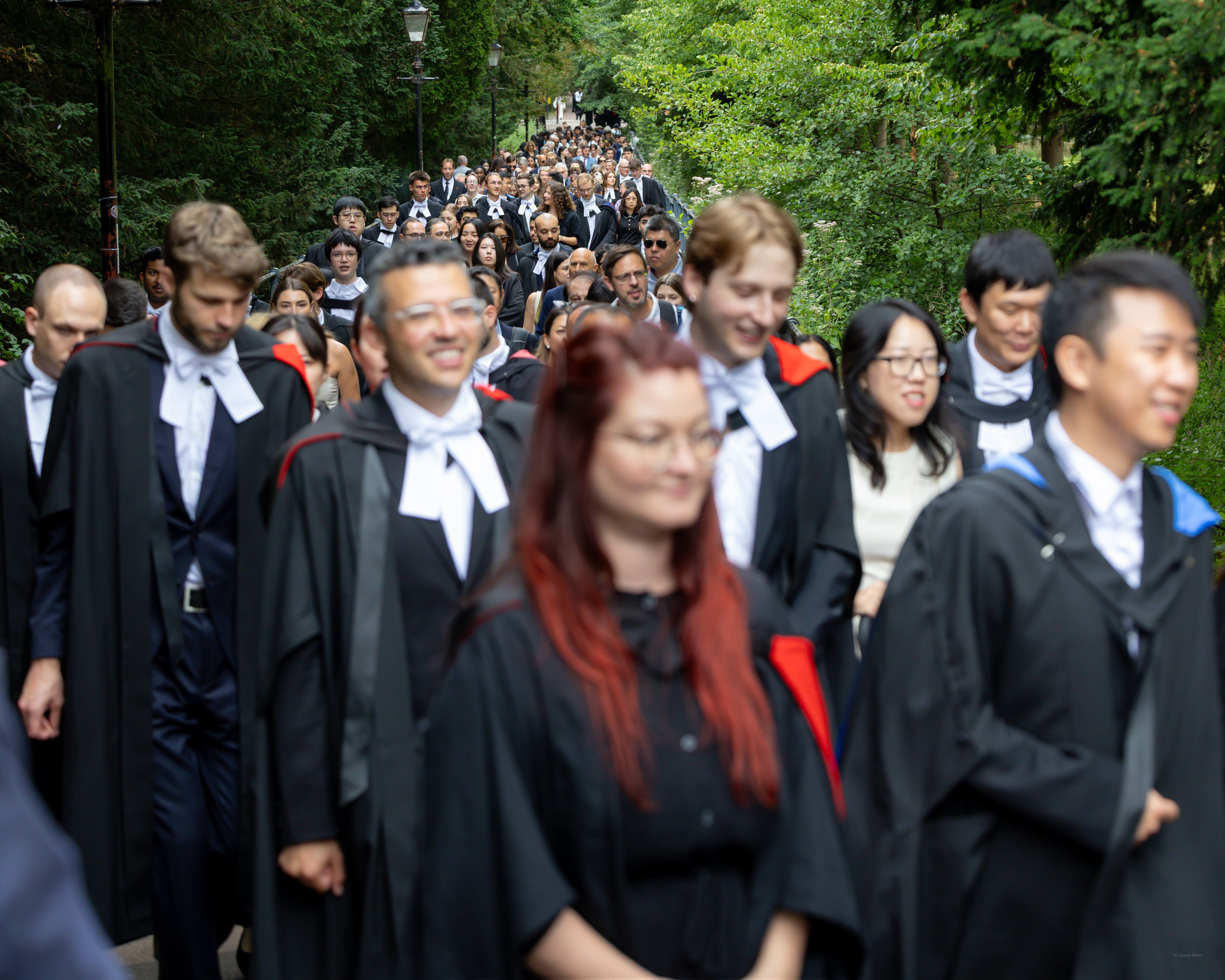 Cambridge students walking along a road.